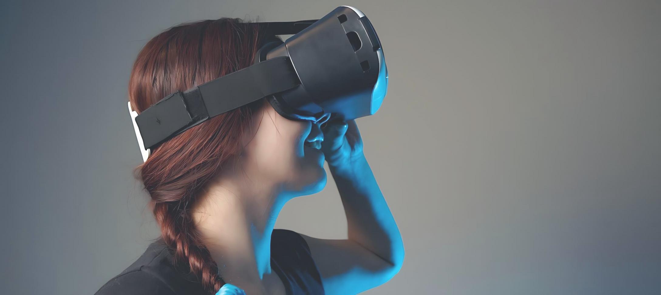 Students working on VR development project with game engine interface visible on screen